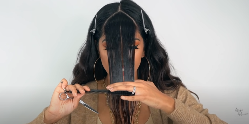 Comb hair in a straight line in front of face